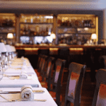 Art Deco dining room interior at 34 Mayfair restaurant near Grosvenor Square London with burnt orange banquettes and open charcoal grill