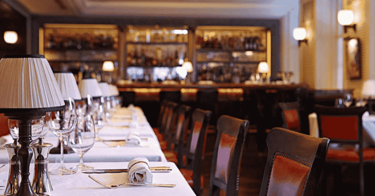 Art Deco dining room interior at 34 Mayfair restaurant near Grosvenor Square London with burnt orange banquettes and open charcoal grill